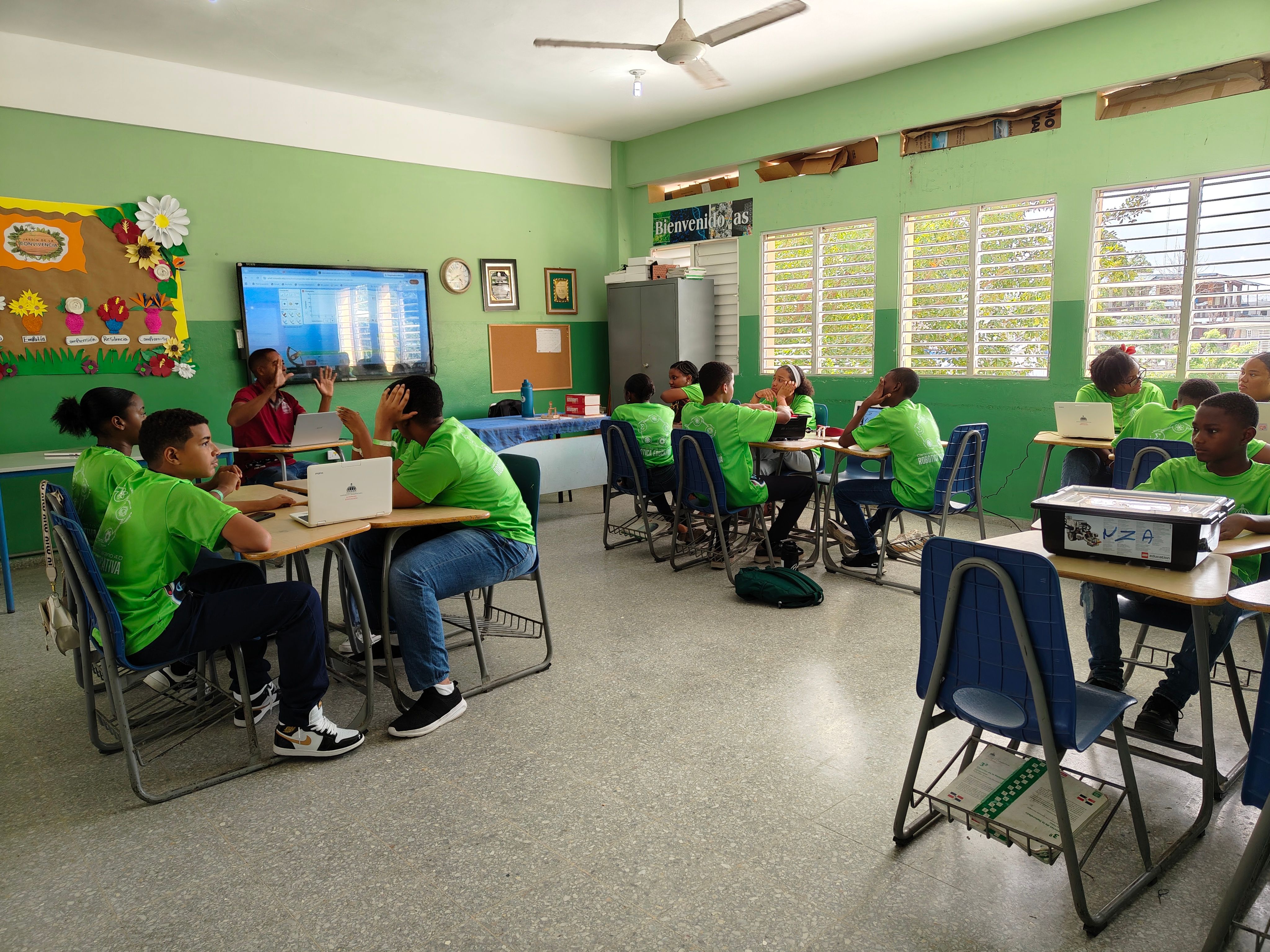 Students in a colorful classroom engaging with technology during a quiz-based lesson